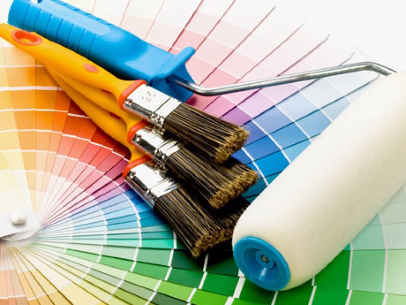 Brushes and paint-roller on a colour guide